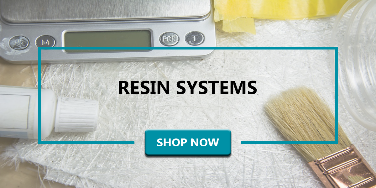 Chopped strand mat, small scale, catalyst, small chip brush sitting on table. Words