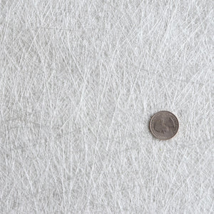 Up close image of fiberglass mat made up of 1.5" to 3" fiberglass strands.