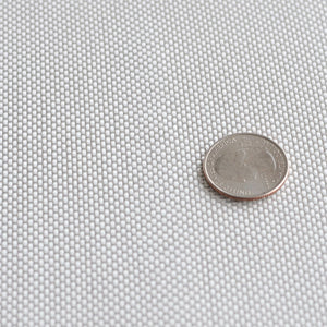 Fiberglass fabric 6 ounce by 50 inch width plain weave. Quarter on fiberglass fabric for size reference.