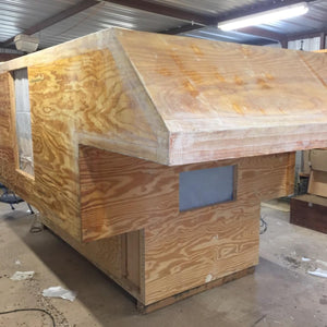 Truck camper under construction. Fiberglass tape used to seal seams and corners.