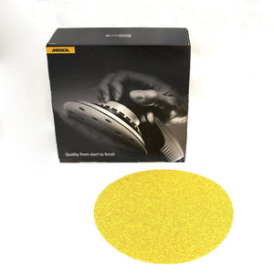 Box of Mirka Gold sand paper with one yellow sanding discs shown in front. Shows the grit.